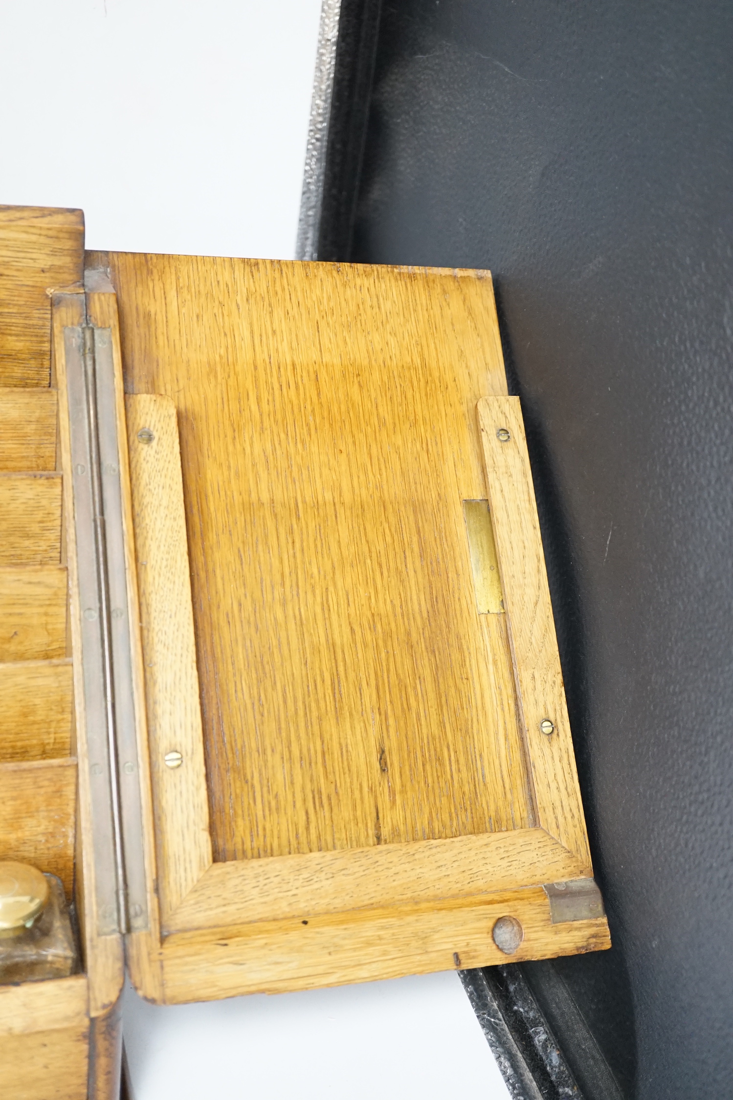 An Edwardian oak stationery casket, 31cm high, 38cm wide, 21.5cm deep